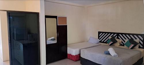 シャリニ ガーデン ホテル & アパートメンツ