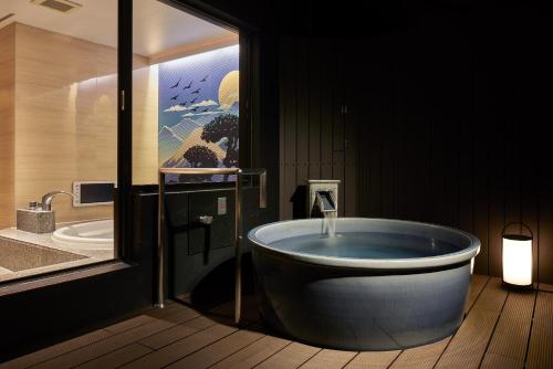 Hot spring bath, Hotel HOQA Hanaironoyu in Minami