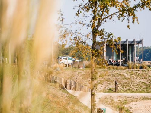 Chalet with a view of the beach or harbour, in a holiday park on the Leukermeer