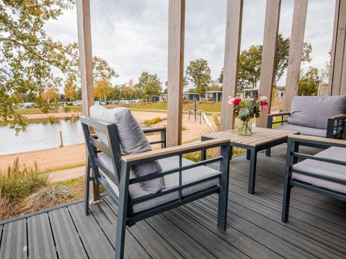 Chalet with a view of the beach or harbour, in a holiday park on the Leukermeer