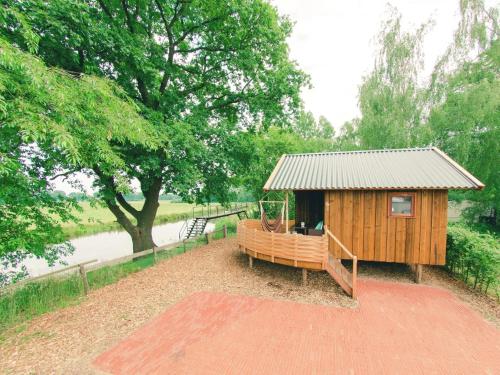  Charming cottage with terrace, in a holiday park on the river De Regge in Zuna