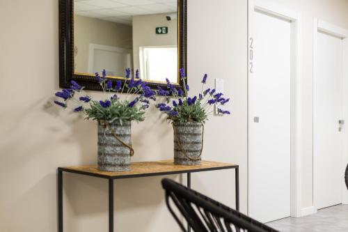 Shared lounge/TV area, Piccolo Catalunya Hostel in Alghero