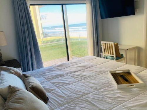 Coastal Waters Retreat 115 - A 1st Floor Beautiful Remodeled Ocean View Condo in New Smyrna Beach, USA