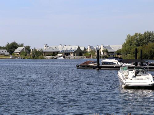 Modern design lodge on the water located on a holiday park in a national park