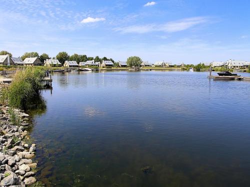 Modern design lodge on the water located on a holiday park in a national park