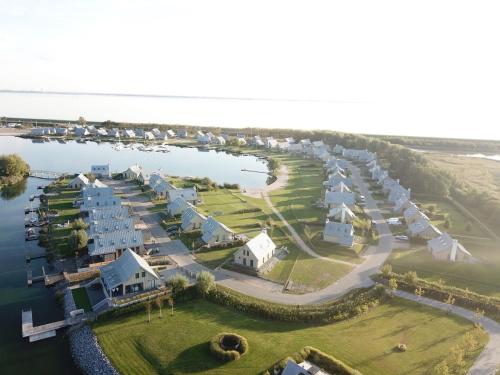 Modern design lodge on the water located on a holiday park in a national park