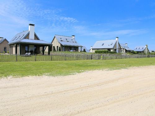 Modern design lodge on the water located on a holiday park in a national park