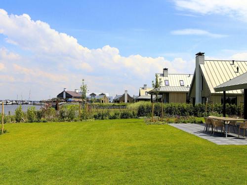 Modern design lodge on the water located on a holiday park in a national park