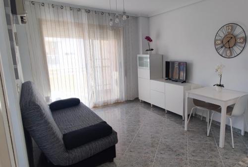 Acogedor apartamento en Daimús junto a la playa con parking privado y piscinas comunitarias