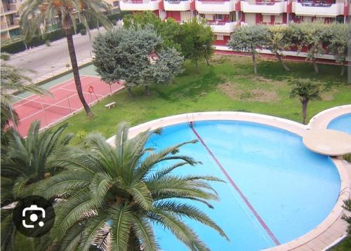 Acogedor apartamento en Daimús junto a la playa con parking privado y piscinas comunitarias