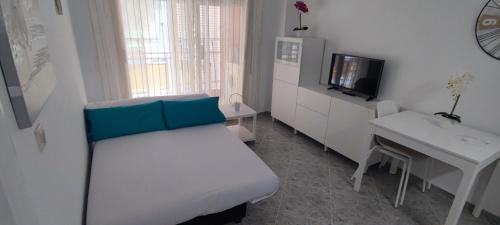 Acogedor apartamento en Daimús junto a la playa con parking privado y piscinas comunitarias