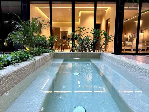 Modern Loft with Rooftop Pool Steps from the Beach by Solmar Rentals in Playa del Carmen, Mexico