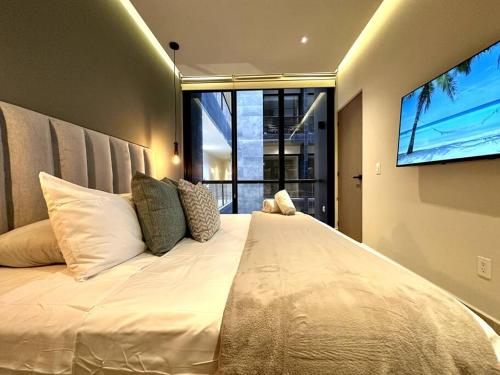Modern Loft with Rooftop Pool & Gym by Solmar Rentals in Playa del Carmen, Mexico