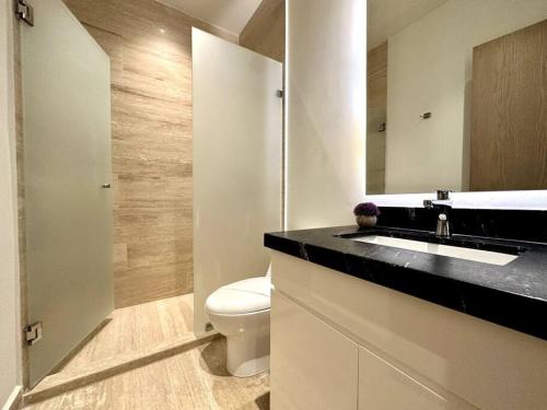 Modern Loft with Rooftop Pool & Steps from the Beach by Solmar Rentals in Playa del Carmen, Mexico