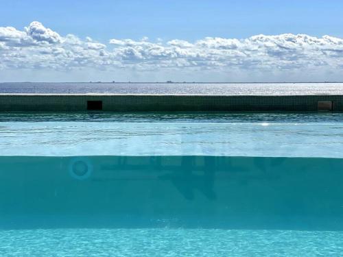 Modern Loft with Rooftop Pool & Steps from the Beach by Solmar Rentals in Playa del Carmen, Mexico