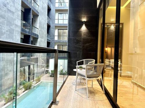 Modern Loft with Rooftop Pool & Steps from the Beach by Solmar Rentals in Playa del Carmen, Mexico