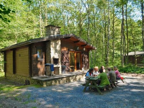 Cozy, wooden chalet with a microwave, located in a forest
