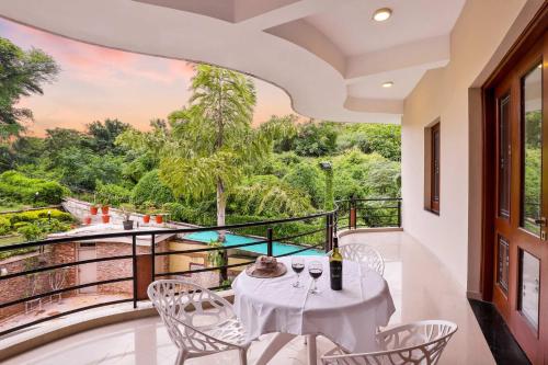 StayVista's Prakriti Farms - Mountain-View Villa with Outdoor Pool, Deck & Lawn featuring a Gazebo