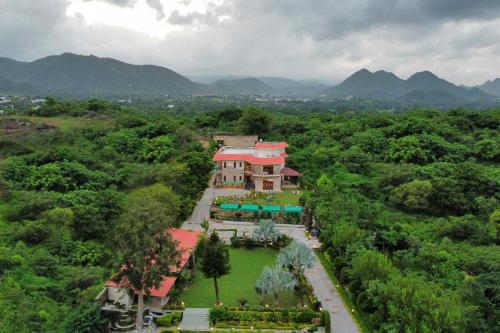 StayVista's Prakriti Farms - Mountain-View Villa with Outdoor Pool, Deck & Lawn featuring a Gazebo