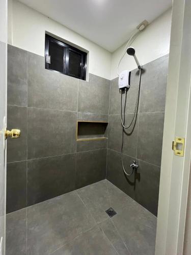 Shower, Maila's Lodging House in Malaybalay