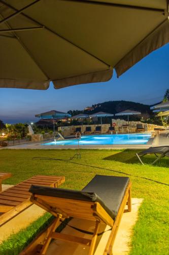 Swimming pool, Charisma Luxury Suite & Rooms in Karavostasi