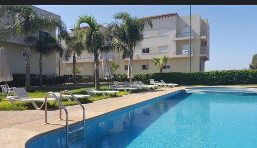 Swimming pool, OASIS BEACH APPARTEMENT MEUBLe RESIDENCE FERMEE AVEC PISCINE TAMARIS 2 SIDI RAHAL in Sidi Rahal