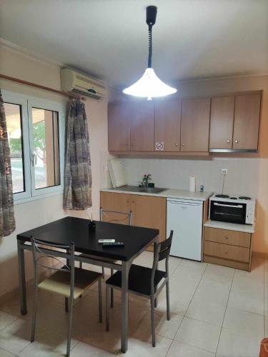 Kitchen, ROMVI VILLAGE in Dexamenes