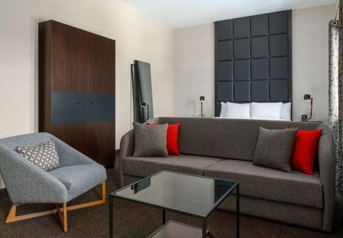Junior King Suite with Seating Area room in Joinery Hotel Pittsburgh Curio Collection by Hilton