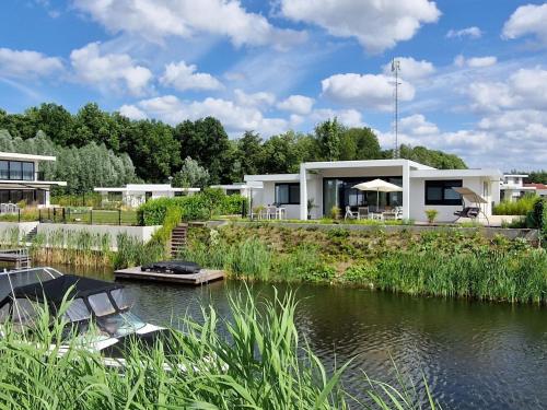  Water villa with jetty and 3 leisure boats in Zeewolde