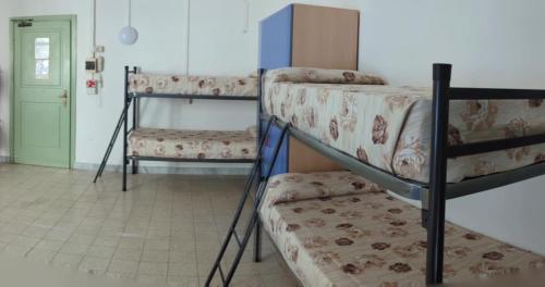 Single Bed in Six Bedroom Female Dormitory Room