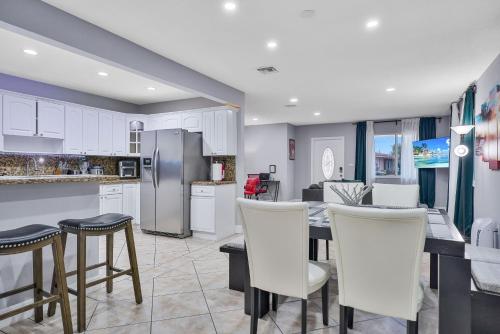 Vacay Spot Gables 4 to 23 Guest GameRoom 2 Kitchens 2 BBQ, 2 BAR, Backyard, Patio, Prime LOC! 6 blocks away from Bars, Nite Clubs, Res, Shops Vacay Spot Gables 4 to 23 Guest GameRoom 2 Kitchens 2 BBQ, 2 BAR, Backyard, Patio, Prime LOC! 6 blocks away from Bars, Nite Clubs, Res, Shops