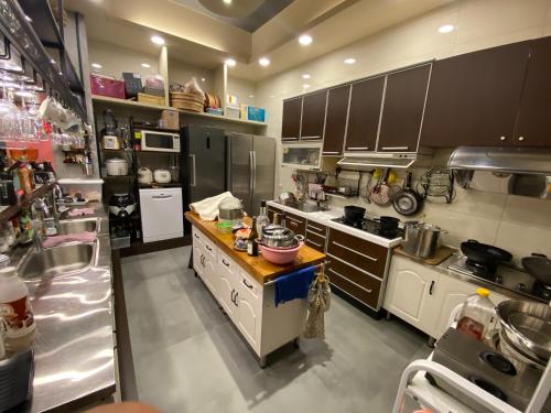 Pearl 150 Homestay - equipped with shared KTV, pool, mahjong and Switch - 주방