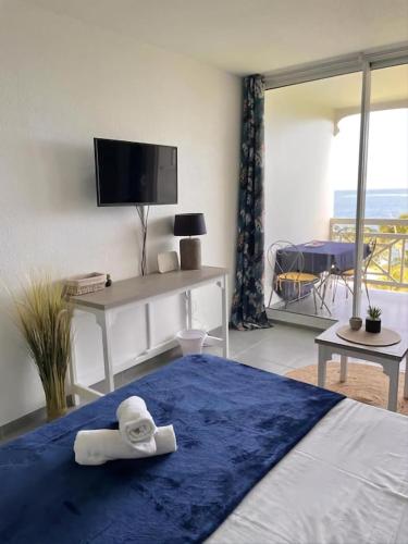 Charmant appartement avec piscine et vue sur mer in เลอ ยามัน