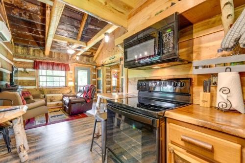 Peaceful Creekside Hideout Cabin with Hot Tub! - image 11