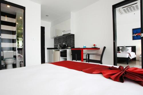 One World One Home Naiharn Hotel - Tap to explore photos