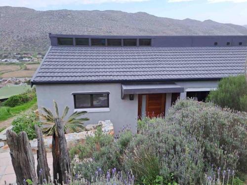 Modern mountainside home with ocean view - Minimal load shedding