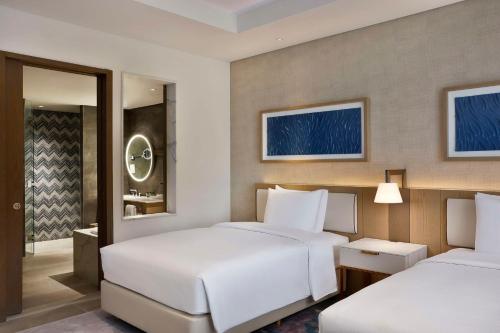 Deluxe Double Room with Two Double Beds, Pool View and Theme Park Access room in Hilton AbuDhabi Yas Island