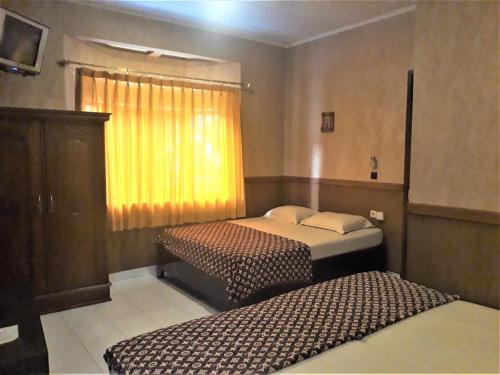 Orange Home Syariah Room Type - Quadruple Room