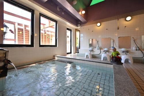 Hot spring bath, Tsugaike Hill Top Terrace in Hakuba