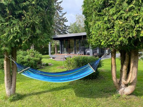 A tiny house with a garden and a hot tube