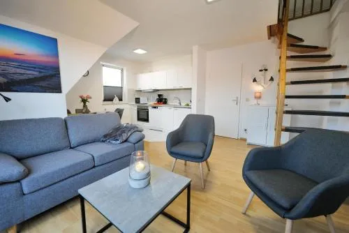 HAUSTIERFREI - Ferienwohnung Meerfarbig Zingst - GLASFASER -Balkon - Parkplatz - Fahrradschuppen - zentral&ruhig - E-Ladesäule - Waschtrockner - Nichtraucher - allergikerfreundlich in Zingst, Deutschland
