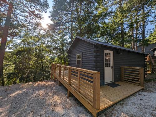 Log Cabin #2 with hot tub deck and sunset view at Loblolly Pines