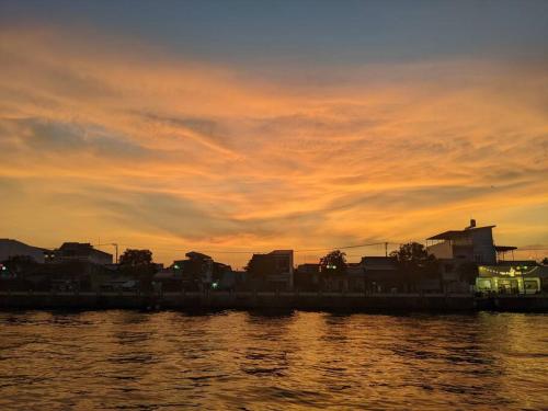 Here Library - A wooden home by the river with a library