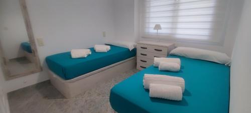 Acogedor apartamento en Daimús junto a la playa con parking privado y piscinas comunitarias