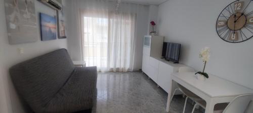 Acogedor apartamento en Daimús junto a la playa con parking privado y piscinas comunitarias