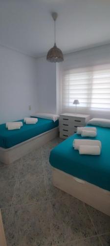 Acogedor apartamento en Daimús junto a la playa con parking privado y piscinas comunitarias