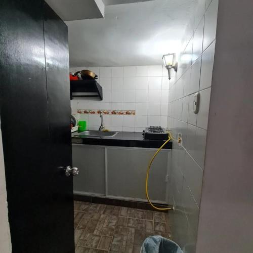 Kitchen, Apartamentos La Marina in Petares