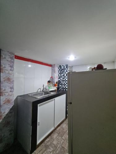 Kitchen, Apartamentos La Marina in Petares