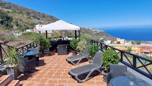 ห้องส่วนกลางสำหรับนั่งเล่น/ดูทีวี, Apartamentos Monasterio de San Antonio in อีกอด เด โลส บิโนส