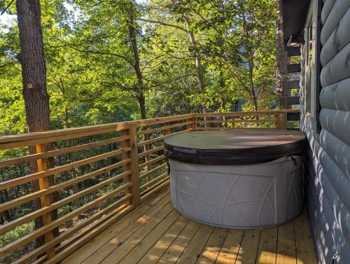 Cabin #6 with hot tub deck and sunset view at Loblolly Pines in Eureka Springs, USA